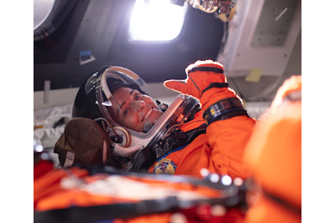 NASA astronaut Nicole Mann is assigned to the first flight of Boeing's Starliner; here she is trying out a mockup of the larger Orion capsule that will head to the Moon. (Credit: NASA/Bill Ingalls)