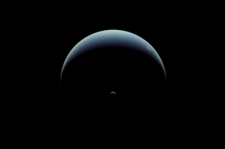 Crescent Neptune seen by Voyager 2 on August 31, 1989. The spacecraft was looking back at the known planets, even as it was racing off toward uncharted space. (Credit: NASA/JPL-Caltech/Justin Cowart)
