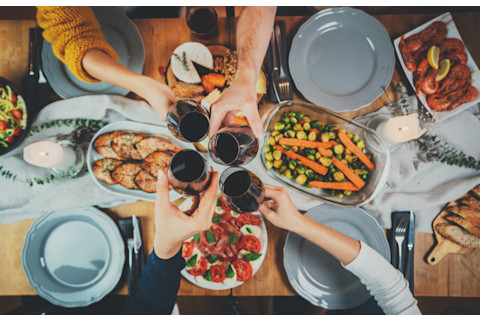 friends sharing red wine mediterranean diet