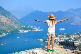 Young tourist woman enjoying view of kotor